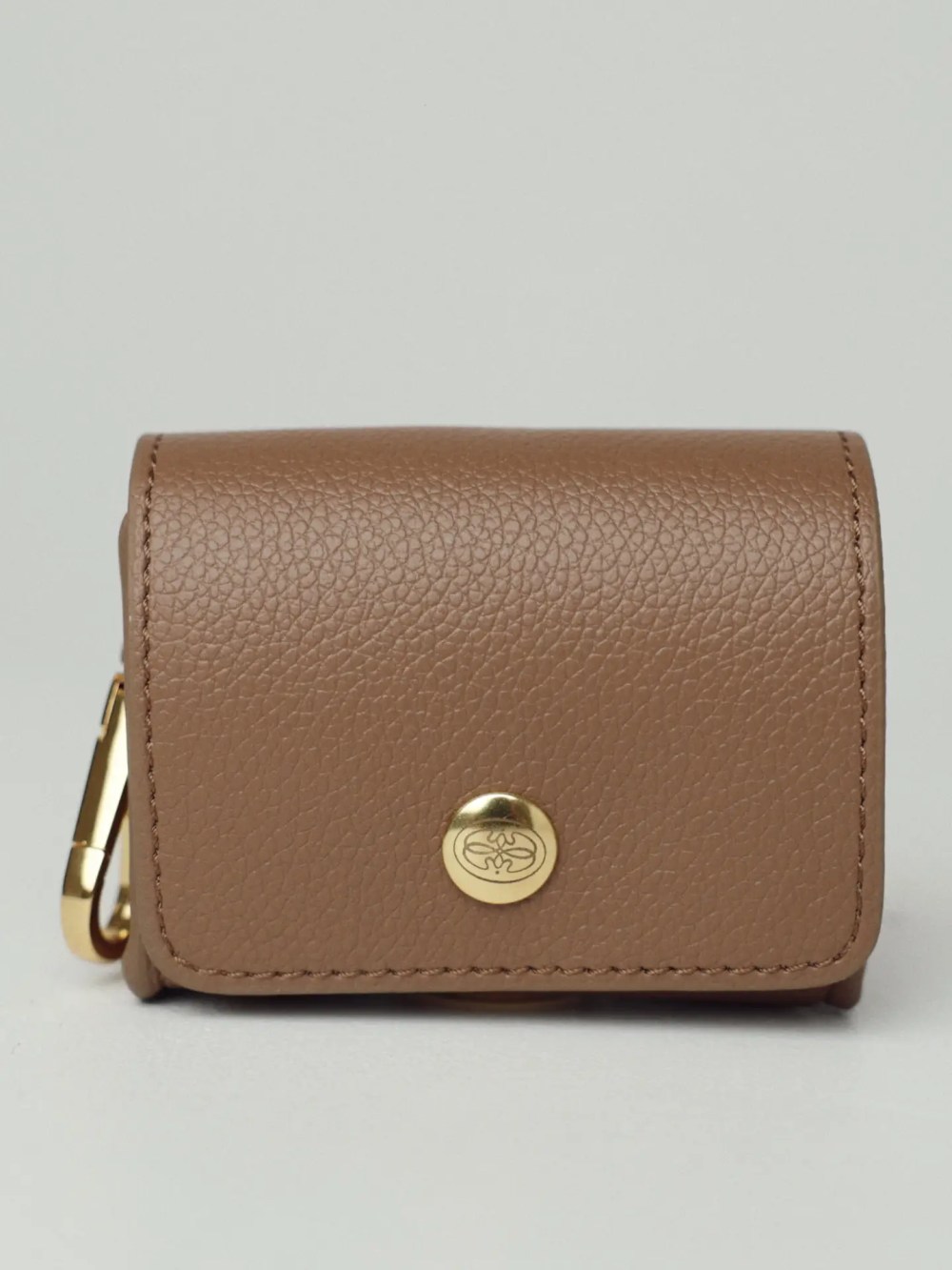 Brown dog poop bag holder with gold hardware by Oliva Pet Atelier.