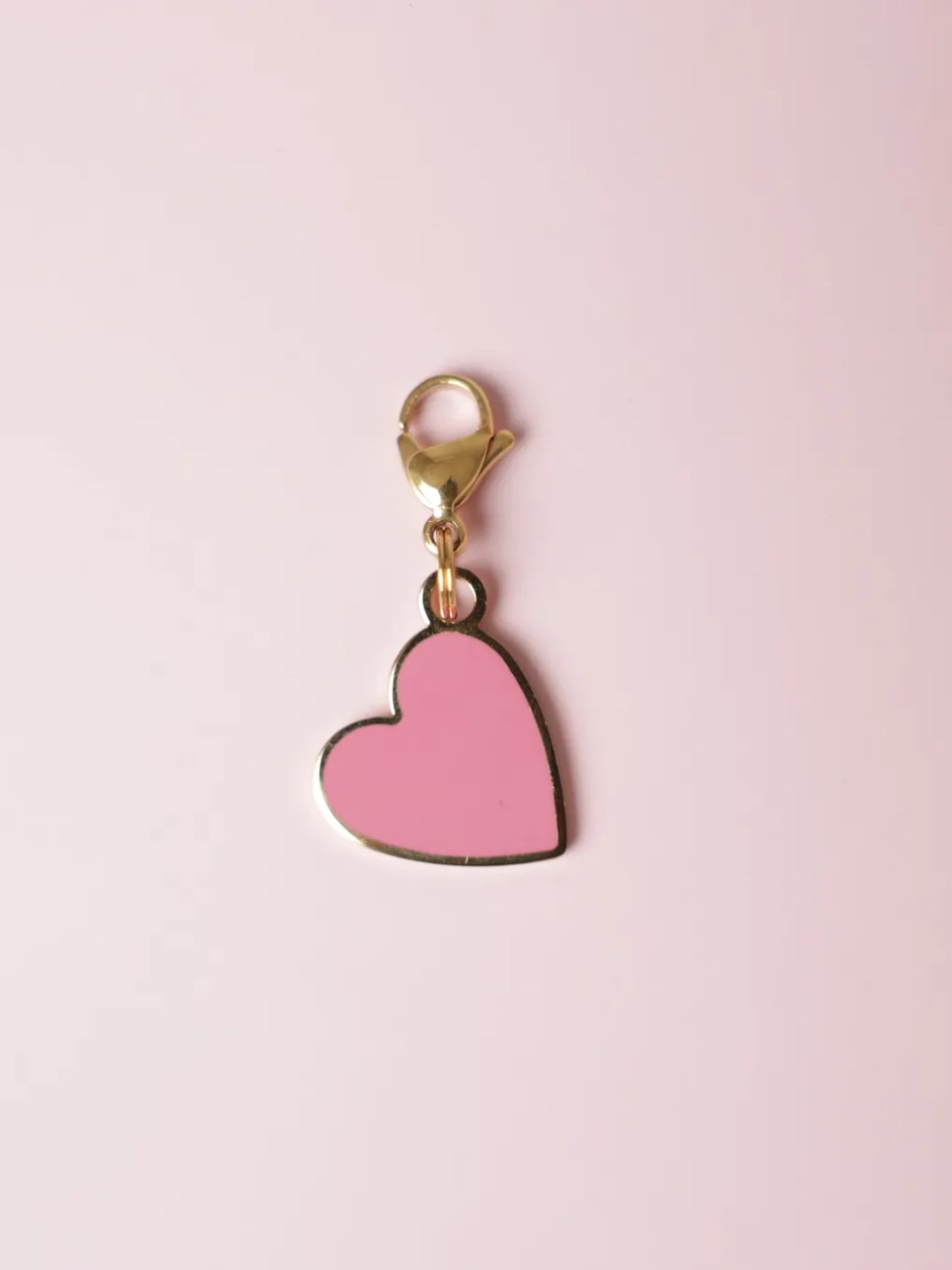 Pet jewelry: red and gold heart charm.