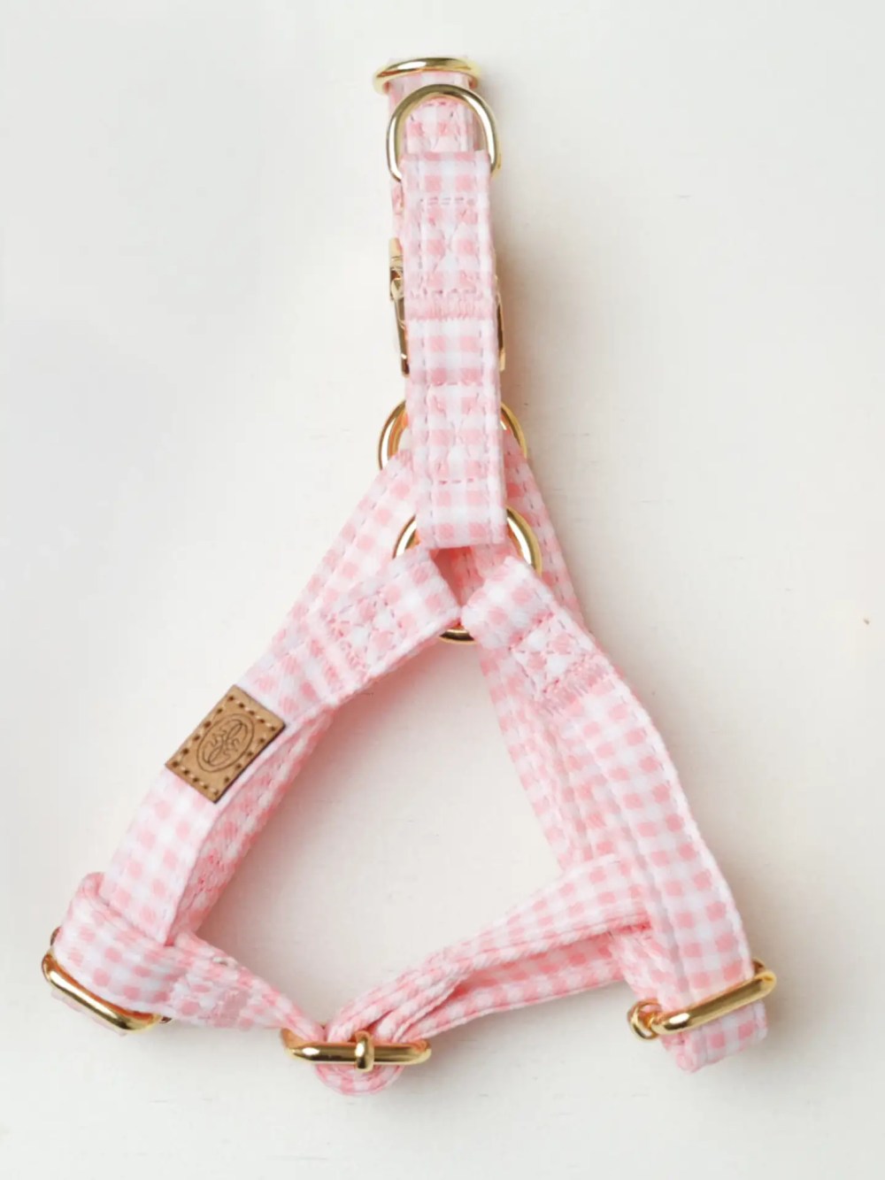 Pink gingham adjustable dog harness with gold hardware by Oliva Pet Atelier.