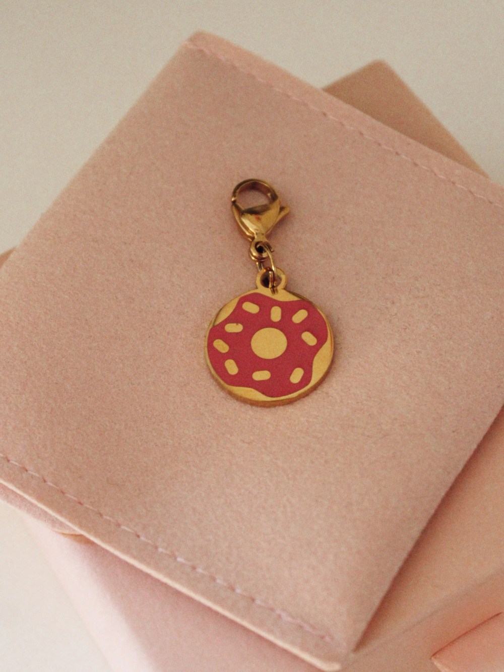 Pink doughnut enamel charm for dog collars made from stainless steel.