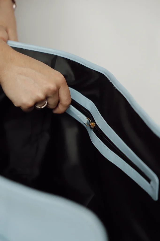 Zip with a leather pull inside the Sky Blue leather dog carrier