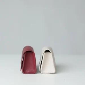 Burgundy and white poop bag holders side by side